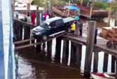 Attempt To Load A Truck On A Ship Using Two Planks