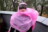 New York City Girl In Pink Poncho Attempts To Brave Hurricane Sandy