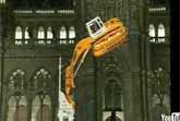 Excavator Climbs Tower