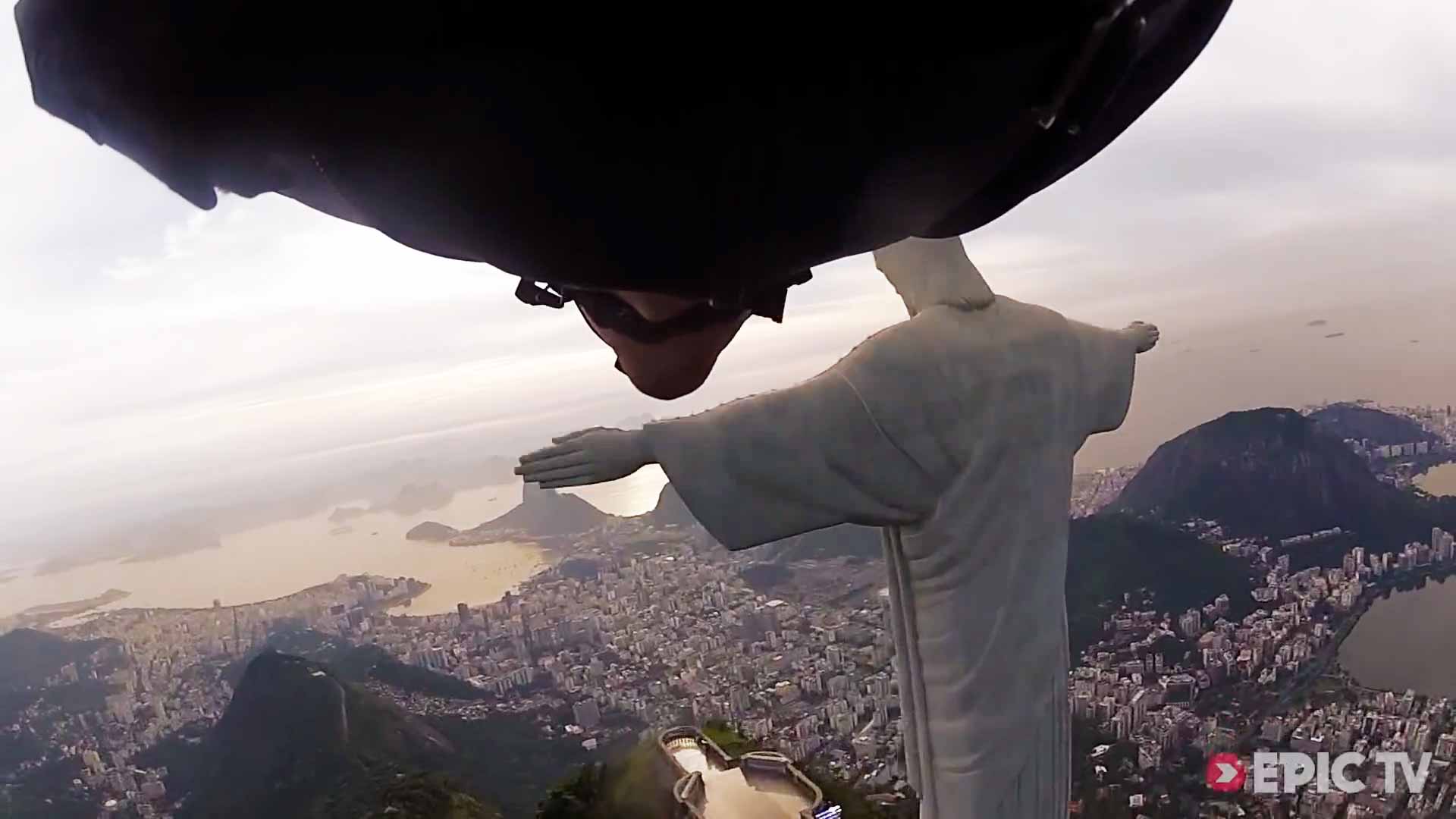 Wingsuit Flight Under Arm Of Christ Statue In Rio De Janeiro Wingsuit Flight Under Arm Of Christ Statue In Rio De Janeiro